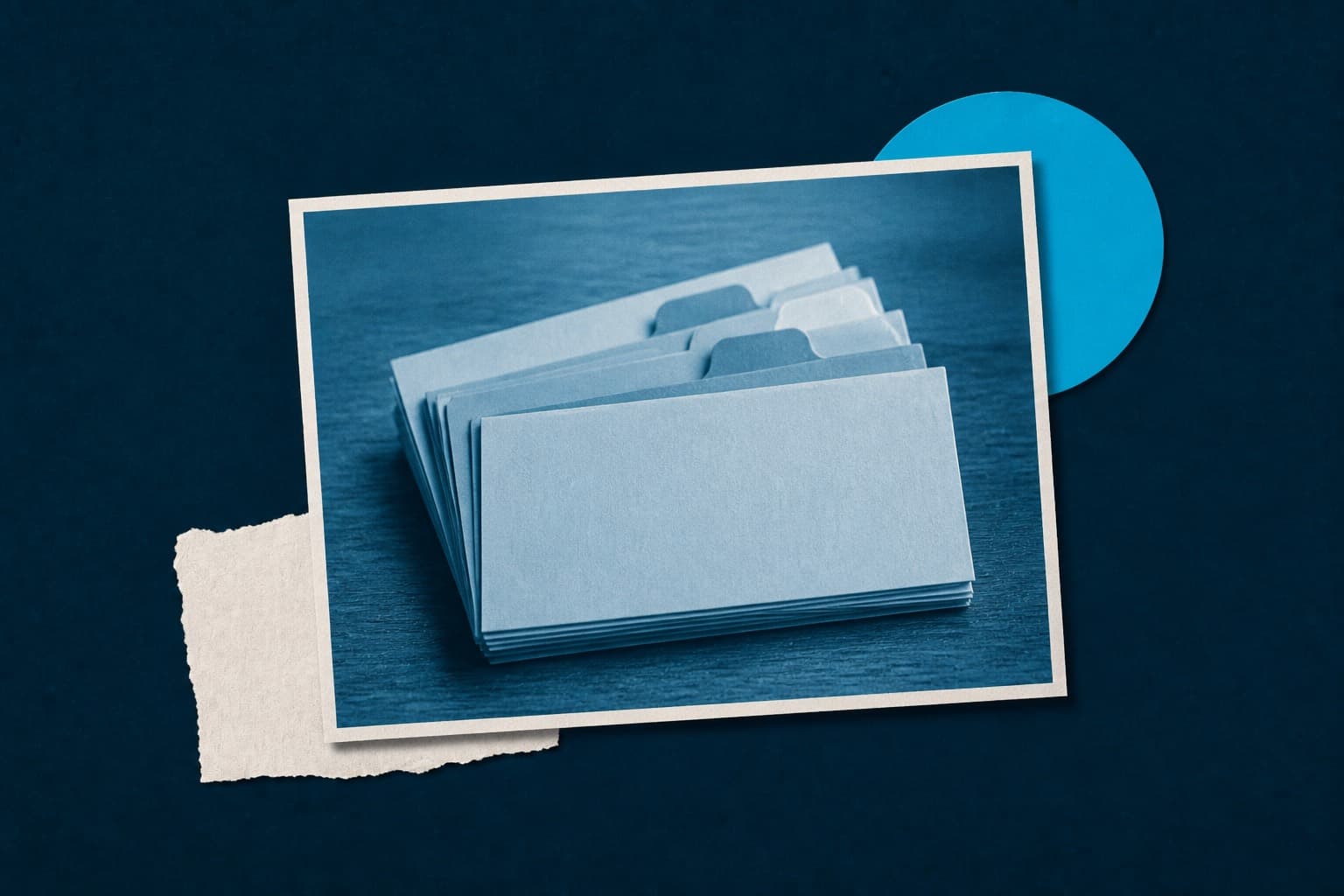 Cyan-duotone photo of a small stack of tabbed index cards on a navy field